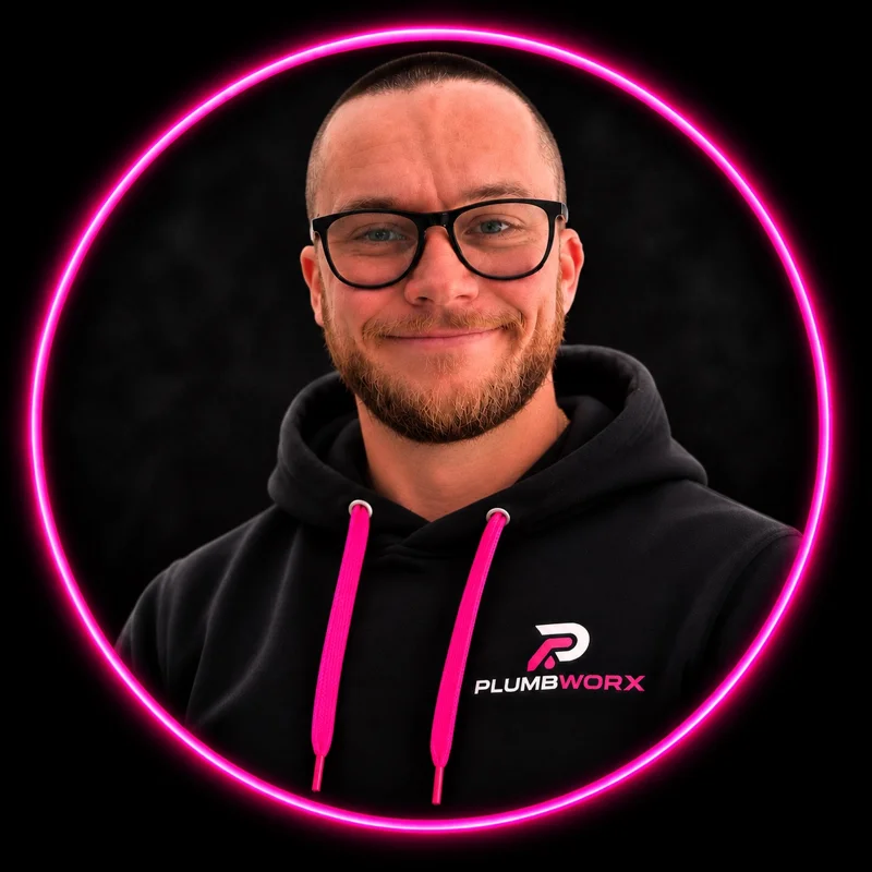Chris, the independent plumber behind PlumbWorx, in his branded black hoodie